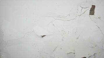 cracked concrete wall covered with gray cement photo