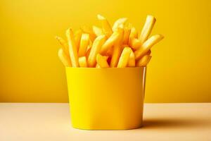 French fries in a special fast food yellow box isolated on white background photo