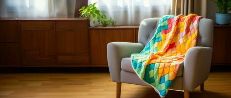Bright and cheery image of a vibrant hand - knit children's blanket draped over a comfy chair vintage ambiance natural light photo