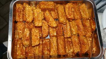Pile of tempe goreng or Fried tempe typical Indonesian food photo