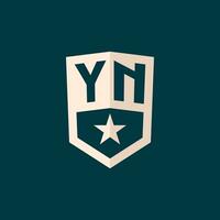 Initial YN logo star shield symbol with simple design vector