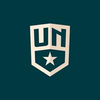 Initial UN logo star shield symbol with simple design vector