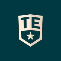 Initial TE logo star shield symbol with simple design vector