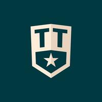 Initial TT logo star shield symbol with simple design vector