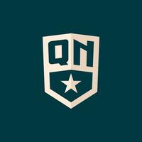 Initial QN logo star shield symbol with simple design vector