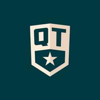 Initial QT logo star shield symbol with simple design vector