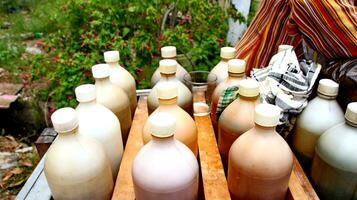 The herbalist is serving the customer, selling Jamu or herb from indonesia photo