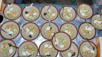 Close up of several bowls of Soto photo