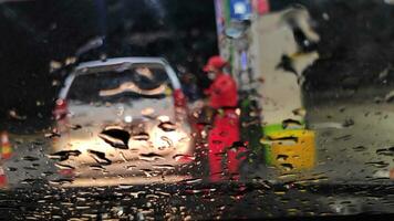 Blurred image process of refueling cars by officers at public gas stations photo