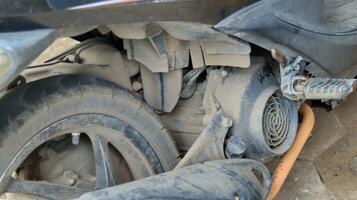 Closeup of dirty and dull motorcycle shockbreaker photo