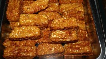 Pile of tempe goreng or Fried tempe typical Indonesian food photo