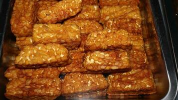 Pile of tempe goreng or Fried tempe typical Indonesian food photo