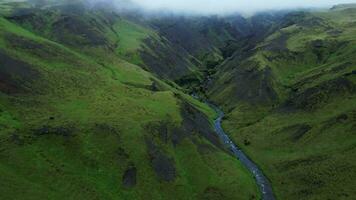 Aerial top down view of Kvernufoss waterfall in Iceland 4K 30p video