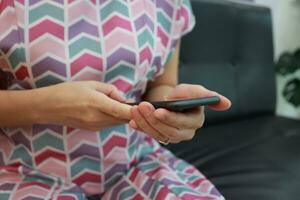Smartphone in hand with blur background photo