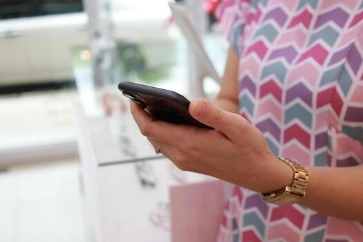 Using phone, holding smartphone, mobile phone in hand photo