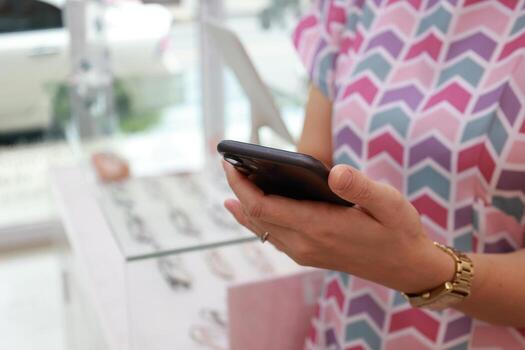 Using phone, holding smartphone, mobile phone in hand photo