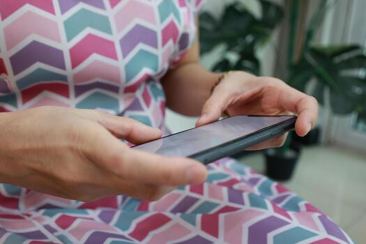 Using phone, holding smartphone, mobile phone in hand photo