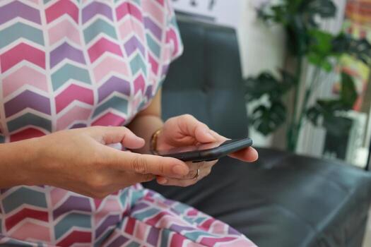 Using phone, holding smartphone, mobile phone in hand photo