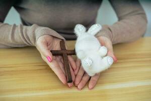 Hands holding doll with Easter concept. photo