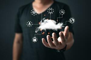 man hold cloud computing system diagram show on hand.Data storage.Digital technology network service business in wireless storage concept. Implementing storage technology support in business. photo