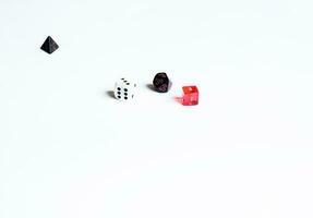 various dice lying on a white isolated background photo