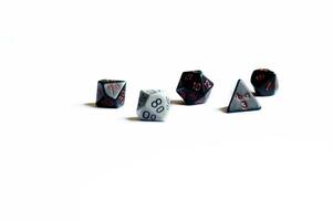 various dice lying on a white isolated background photo