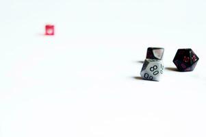 various dice lying on a white isolated background photo