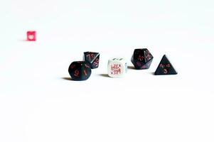 various dice lying on a white isolated background photo