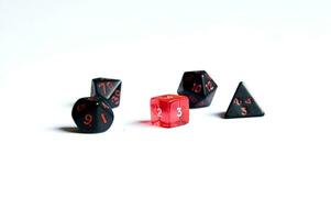 various dice lying on a white isolated background photo