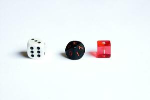 various dice lying on a white isolated background photo