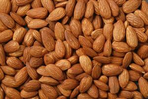 Pattern Organic almond nut raw peeled as background, top view. Healthy snack or for vegetarians. copy space banner. photo