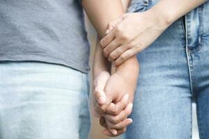 Woman and man holding hands, Happy couple love in the garden. concept couple lover valentine day. photo