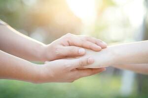 Man holding hands and caring for lover photo