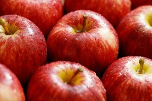 fresh red  apples on the wooden floor photo