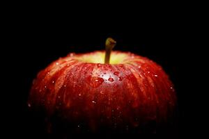 Fresh red apples on black background photo