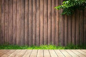 Wooden table with environmental on wood grunge wall texture. photo