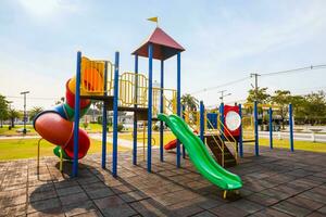 Colorful playground on yard in the park. photo