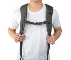 Young man standing with travel backpack equipments isolated white background photo