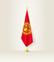 Kyrgyzstan flag on a flag stand. vector