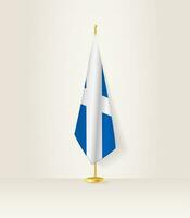 Escocia bandera en un bandera pararse. vector