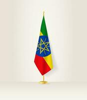Ethiopia flag on a flag stand. vector