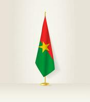 burkina faso bandera en un bandera pararse. vector