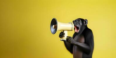 Chimpanzee monkey announcing using hand speaker. Notifying, warning, announcement photo