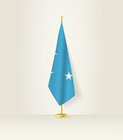 micronesia bandera en un bandera pararse. vector