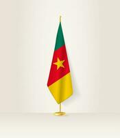 Camerún bandera en un bandera pararse. vector