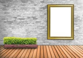 Blank frame vintage on a concrete wall with tree pot on wood floor photo