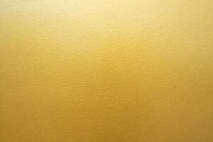 Gold concrete wall on background texture. photo