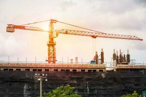 Crane working on structure building outdoor. photo