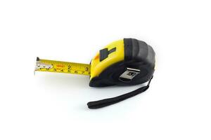 Yellow tape measure or steel tape isolated white background. photo