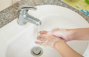 Washing on hands. Cleaning hands with soap. photo